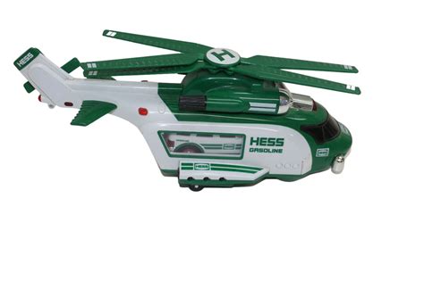 The Hess Toy is brand new and not effected by the cosmetic dents or tears on the box. . Helicopter hess truck